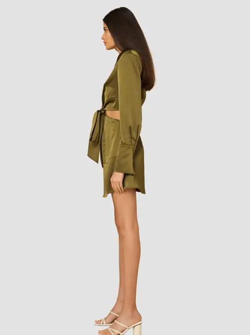 Olive heavy satin mini dress featuring cut out waist design, front button and tie closure and shoulder pads, perfect for a sexy night out.