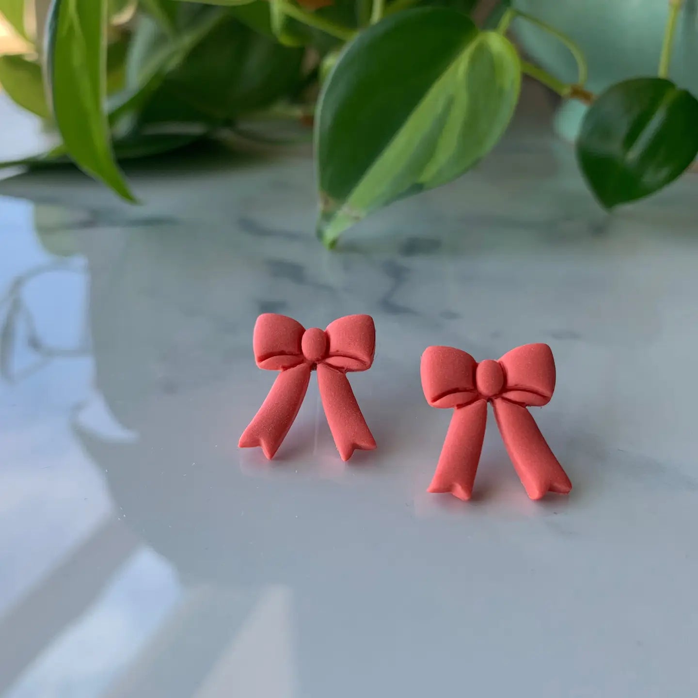 hello neighbor bow earrings