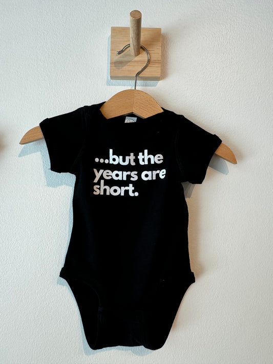 the years are short baby onesie