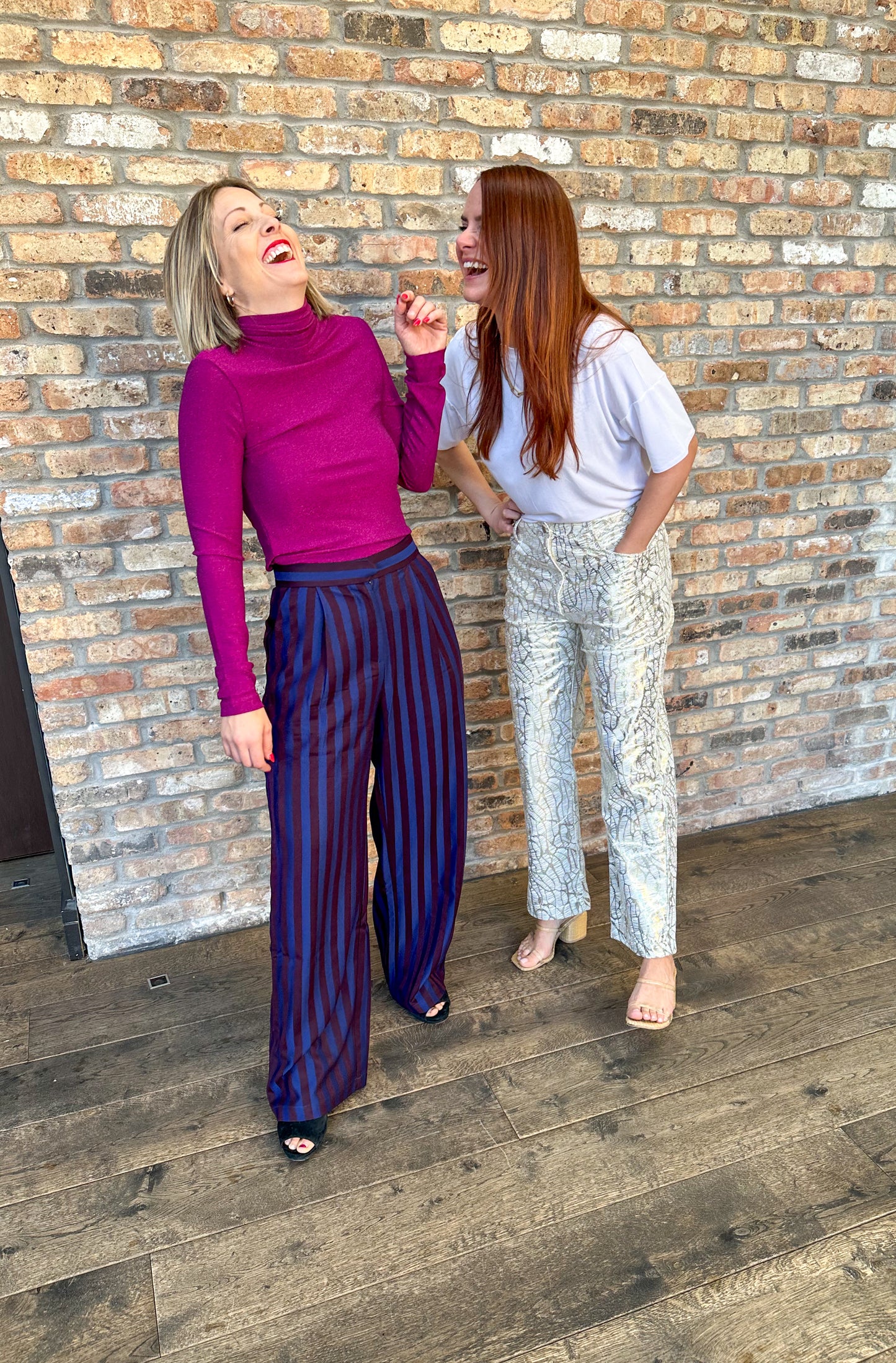 High waisted navy and dark burgundy striped pleated trousers by Frnch. Perfect for holiday parties and events.