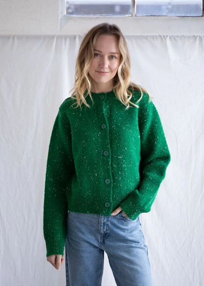 Warm knit cardigan button up sweater in a perfect holiday green, featuring a speckled white yarn throughout for an additional holiday charm. 