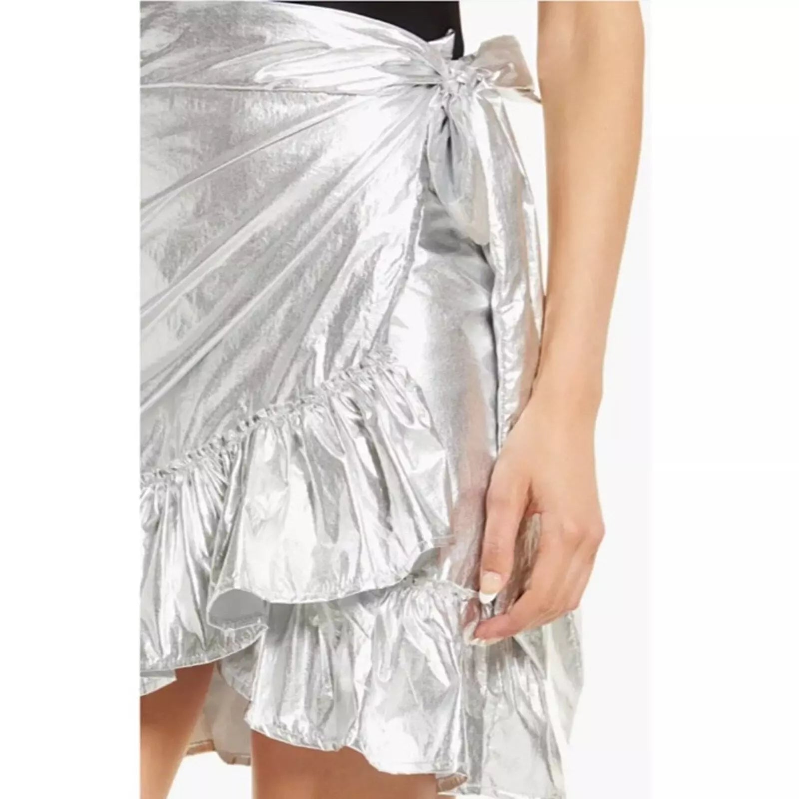 High waisted silver metallic skirt featuring ruffled hip and side tie, perfect for your holiday parties!