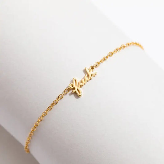 Dainty F* gold chain bracelet