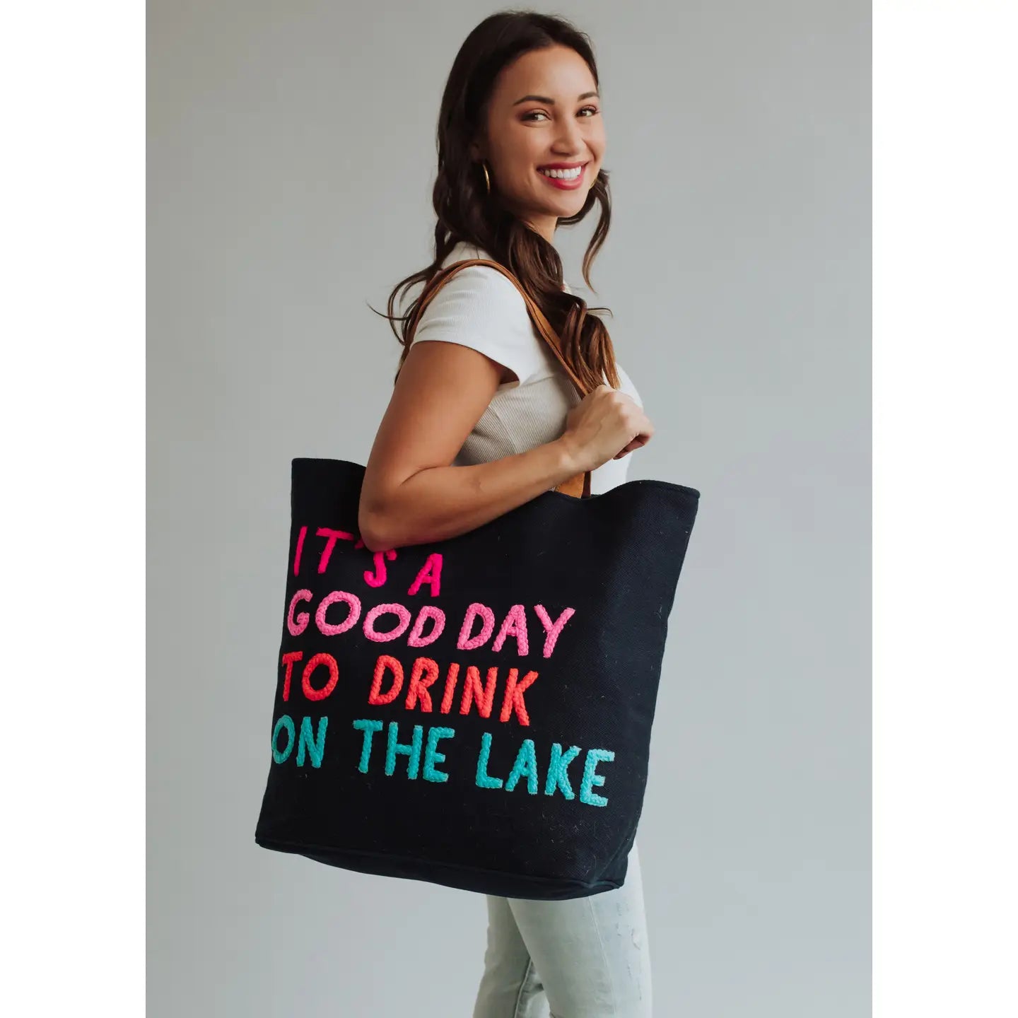 Extra large navy tote with colorful embroidered words "It's a good day to drink on the lake" included with magnetic zipper, double shoulder handle and interior pockets.
