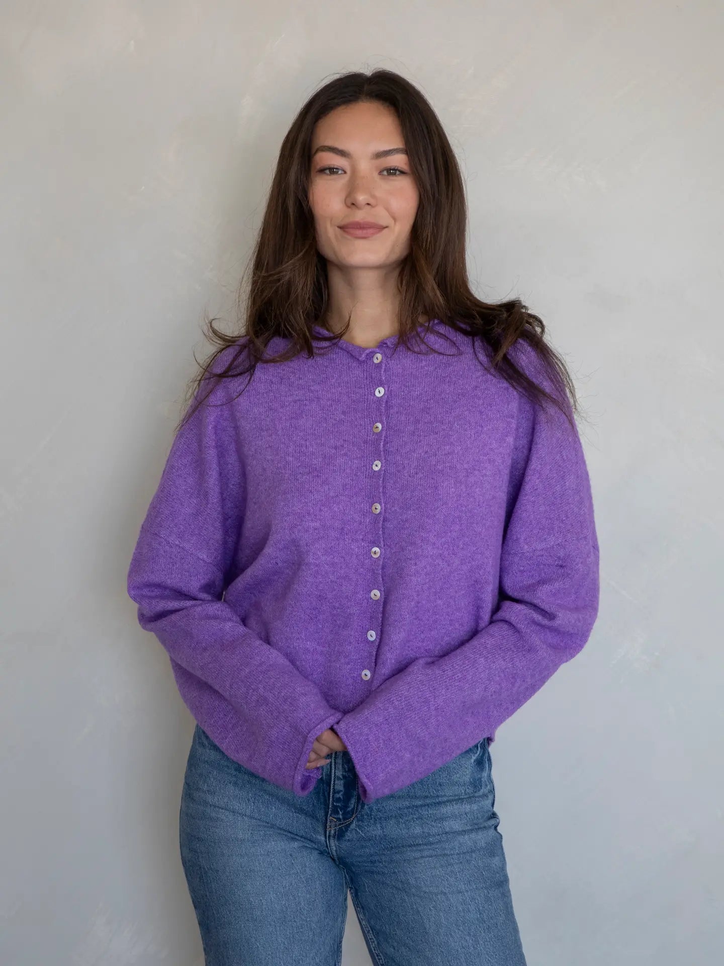 Light purple super soft cardigan featuring delicate small buttons closing the front. The loose fit cardigan sweater is perfect for every day wear.