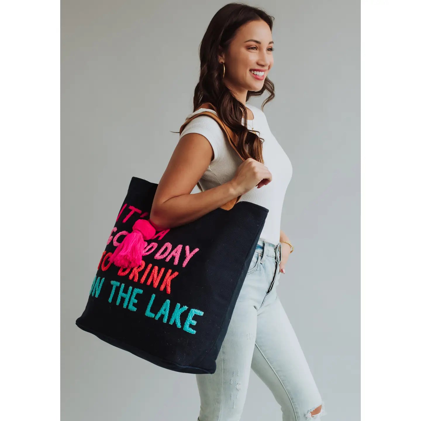 Extra large navy tote with colorful embroidered words "It's a good day to drink on the lake" included with magnetic zipper, double shoulder handle and interior pockets.