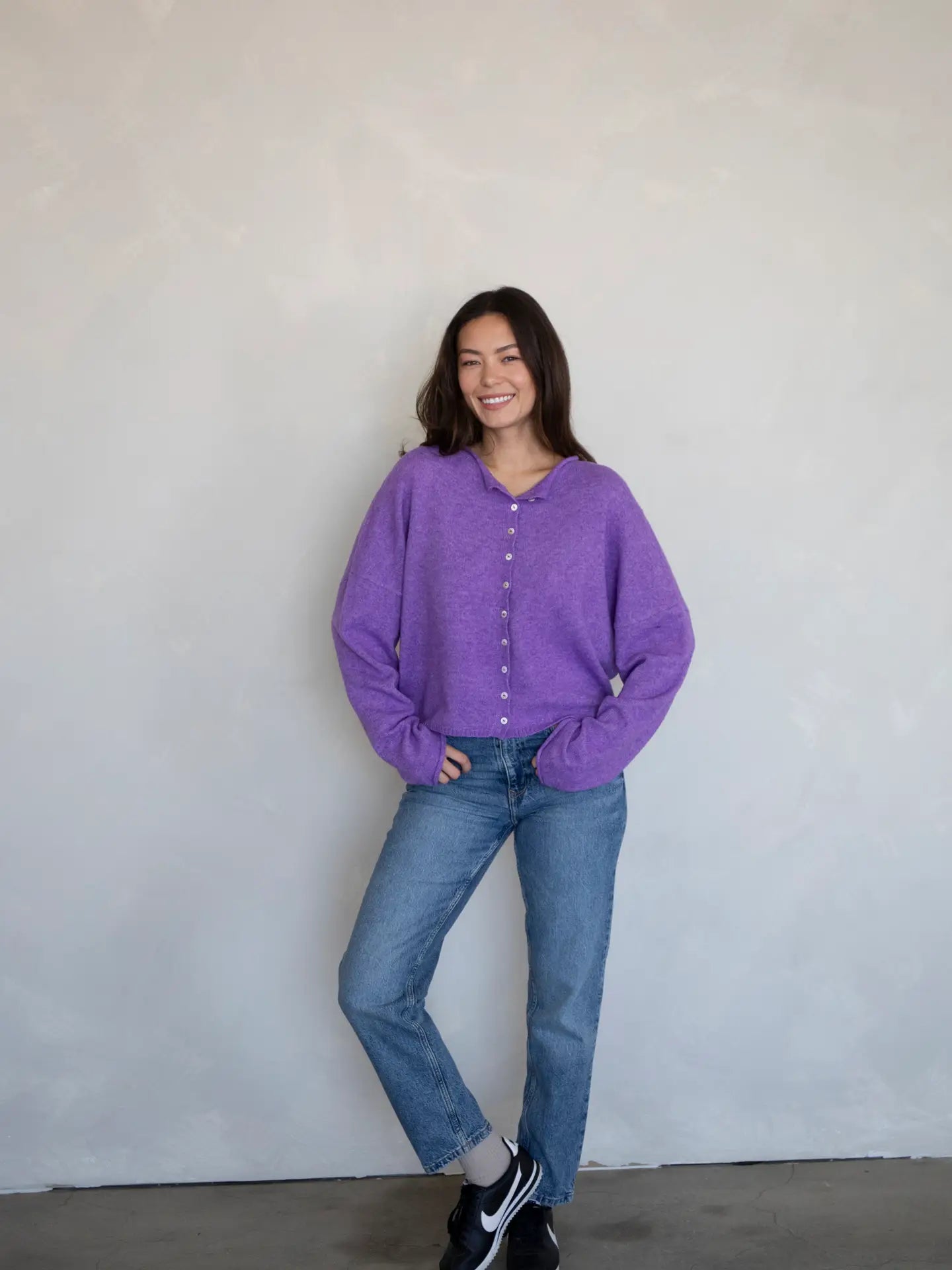 Light purple super soft cardigan featuring delicate small buttons closing the front. The loose fit cardigan sweater is perfect for every day wear.