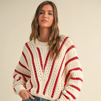 Your holiday go to sweater, the white and red vertical stripes give the sweater a fun holiday vibe.