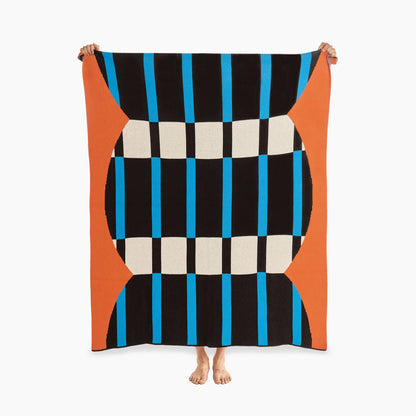 recycled knit blanket with modern artsy design, bright colored blanket, orange, blank, cyan, and white checkered, geometric patterned blanket 