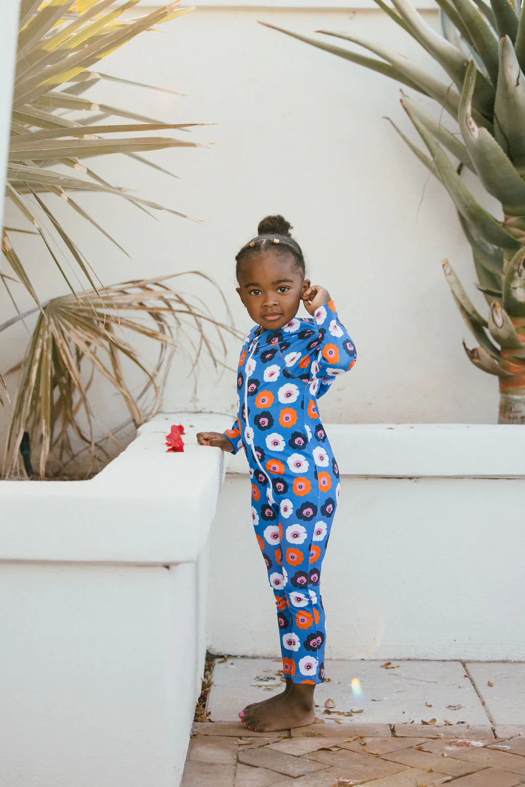 Baby toddler SPF swim one piece with long sleeves and pants with hood, featuring blue floral design.