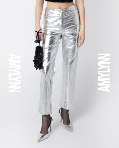 Metallic silver high waisted trousers with straight leg. Featuring front pockets, belt loops and button closure. Perfect for your next holiday party or event.
