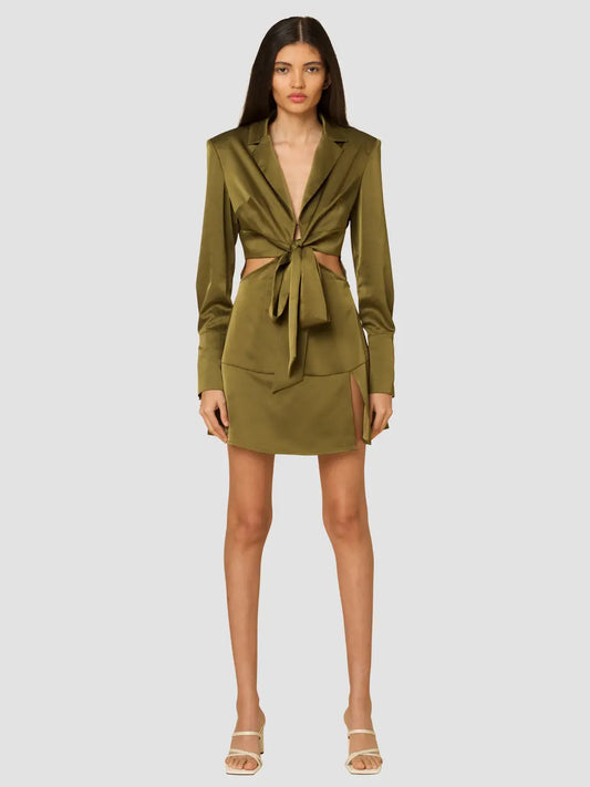 Olive heavy satin mini dress featuring cut out waist design, front button and tie closure and shoulder pads, perfect for a sexy night out.