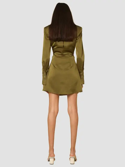 Olive heavy silk mini dress featuring cut out waist design, front button and tie closure and shoulder pads, perfect for a sexy night out.